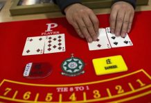 A student displays a deck of cards on a gaming table during a gaming lesson at a mock casino run by the MPI Gaming Teaching and Research Centre in Macau | AGB - Asia Gaming Brief