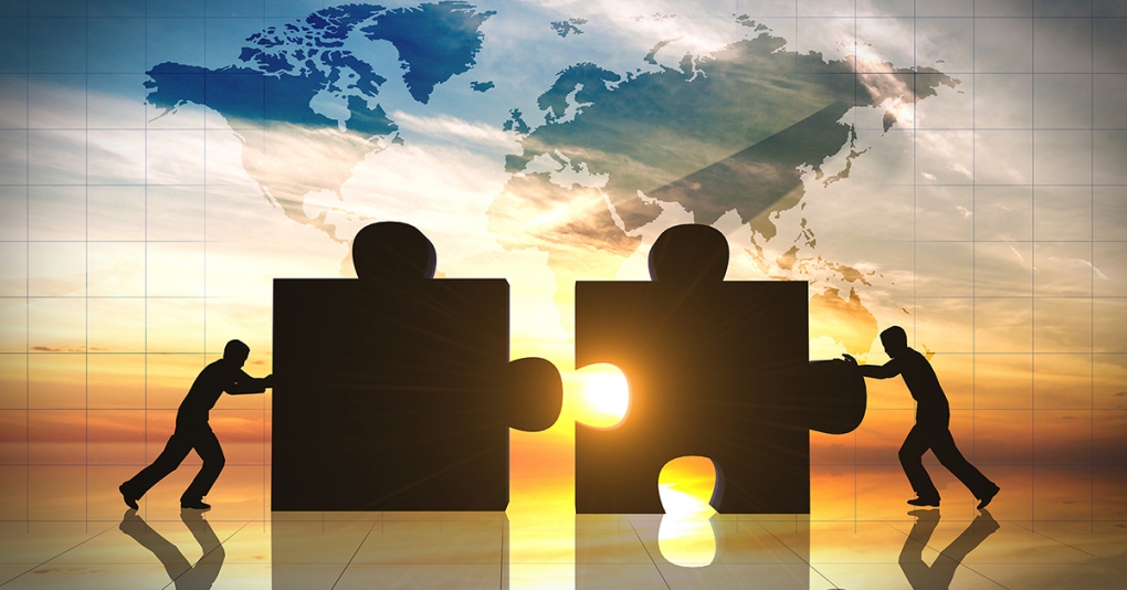 World Business teamwork puzzle pieces