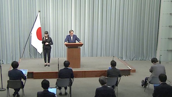 Yoshihide Suga Podium