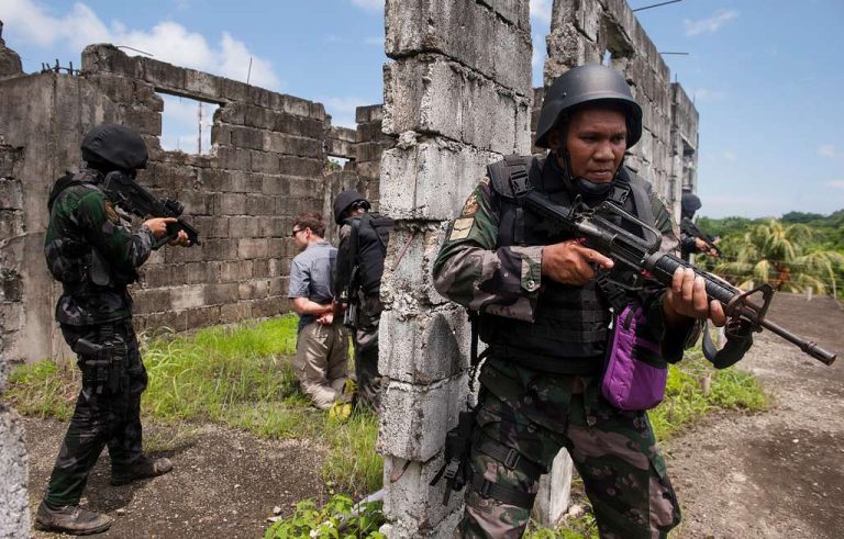 Philippine commandos arrested for providing security to POGO executive