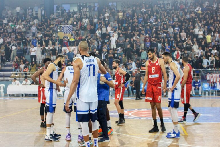 Basketball game in a full indoor arena