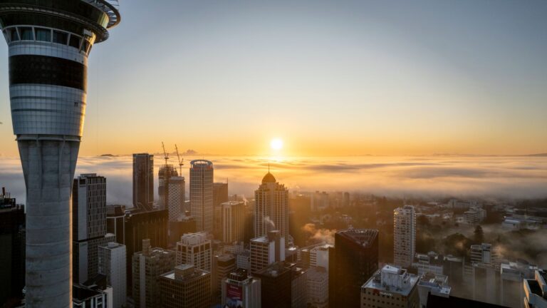 Auckland skyline with the Sky Tower at sunrise