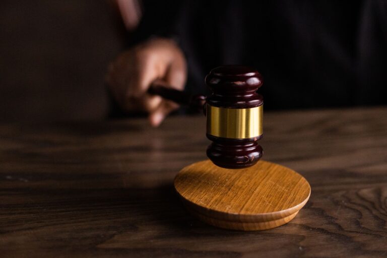 Judge gavel striking a sound block