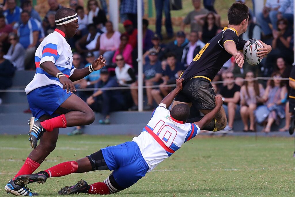 Rugby players contesting the ball during a match